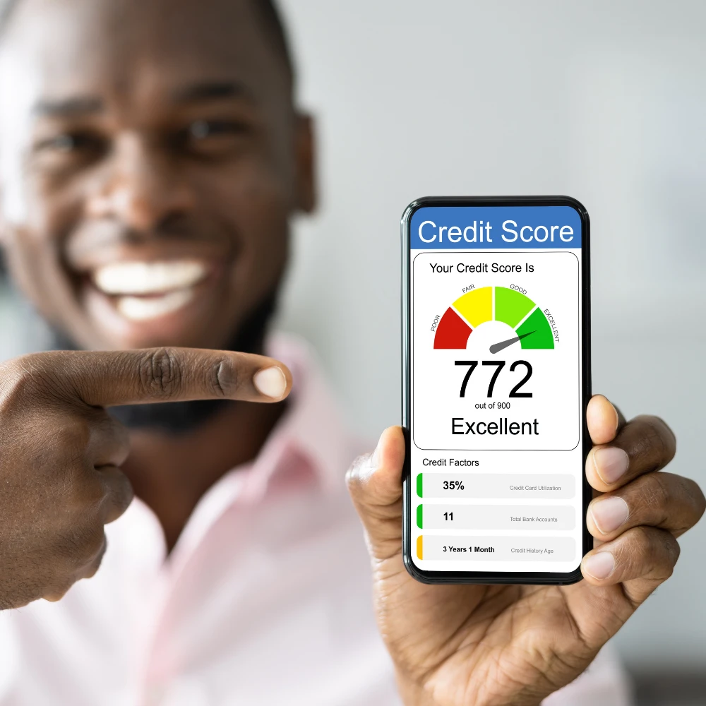 Person holding phone showing excellent credit score